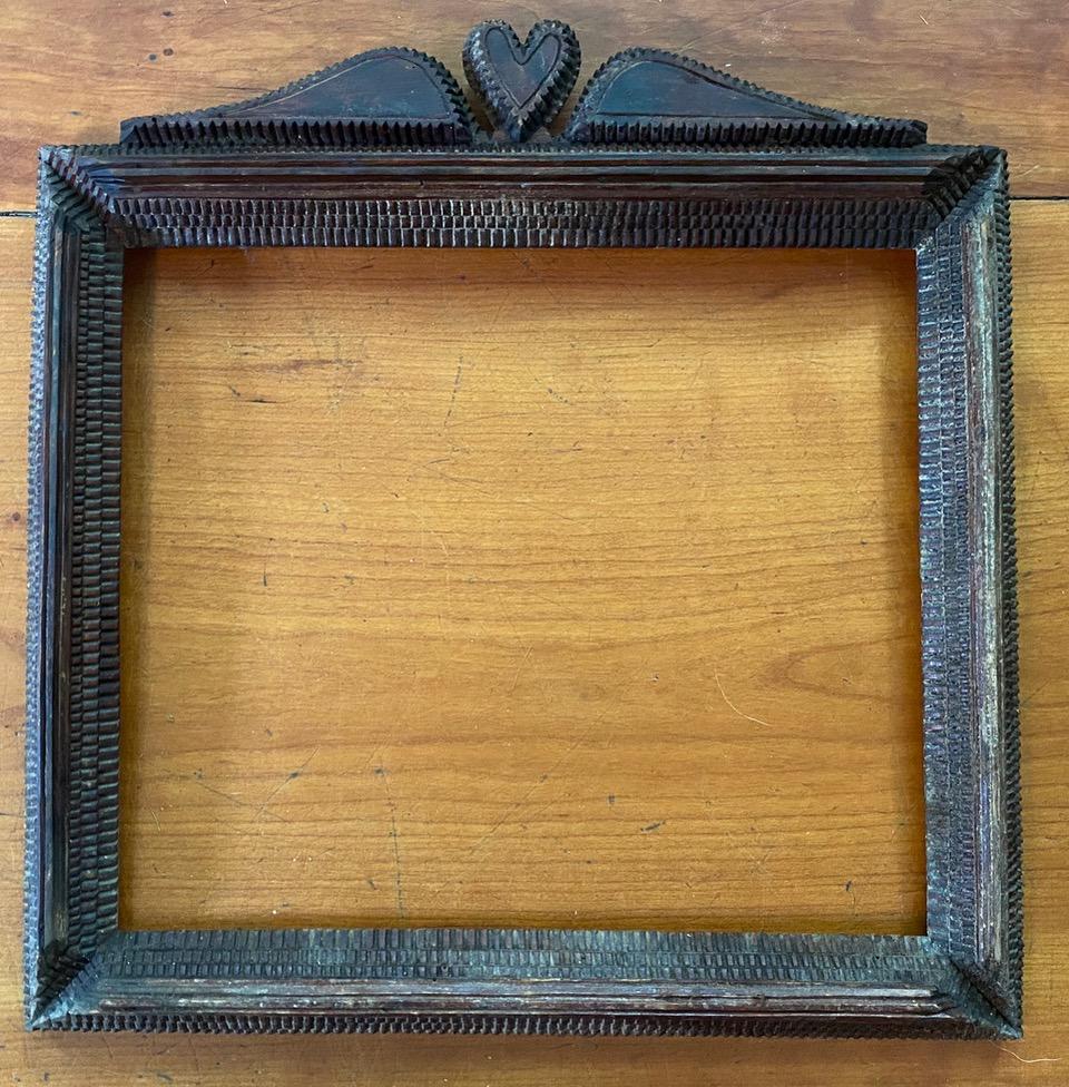 Tramp Art Frame: Title: Tramp Art Frame Description: Winged heart motif Dimension: 16" by 17" Circa: 1930 Shipping: Domestic: Flat-rate of $30.00 to anywhere within the contiguous U.S. International: Foreign shipping 