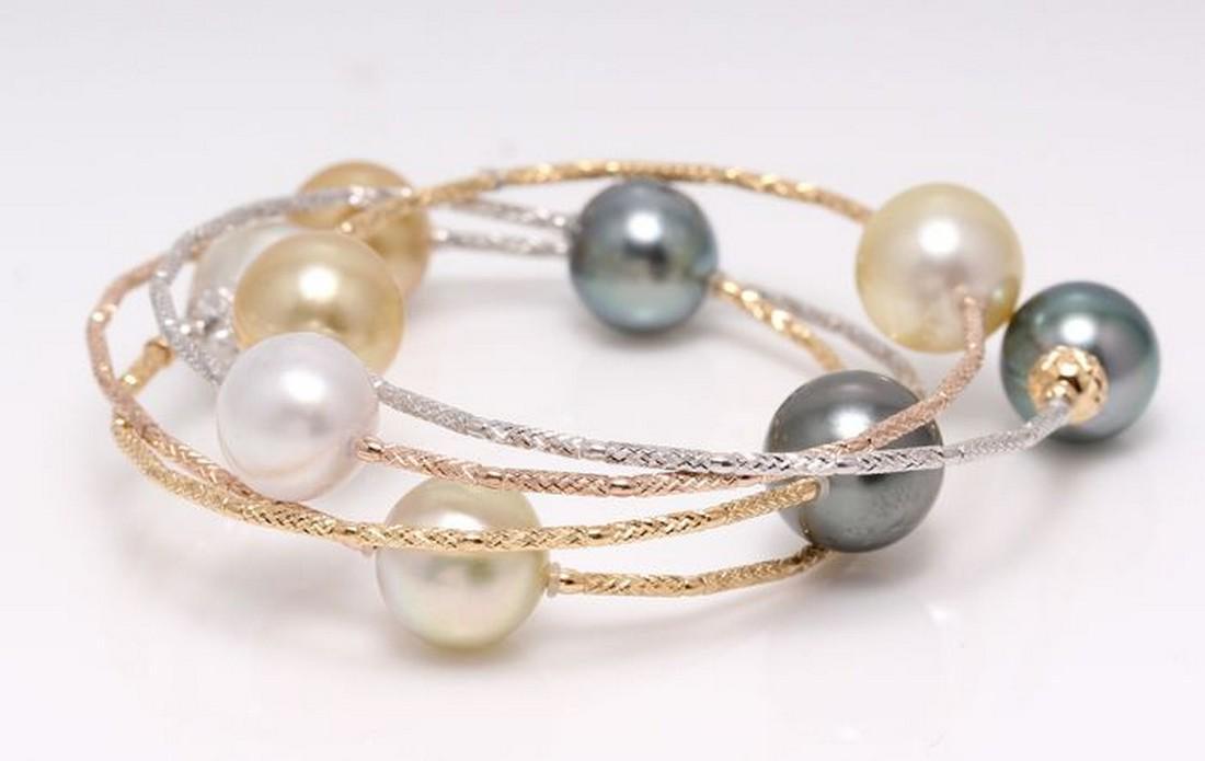 18 kt. Tricolour Gold - 10x11mm Tahitian and South Sea: Description: This bracelet measures 55cm in total and wraps beautifully several times around the wrist. The bracelet contains 9 top quality high lustered South Sea and Tahitian Pearls, 10x11mm each in