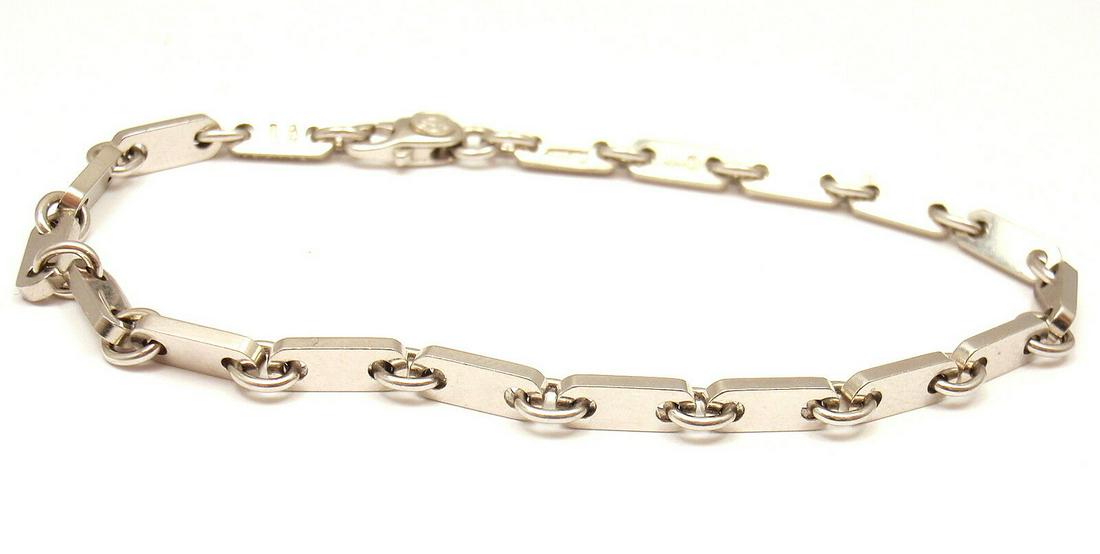 CLASSIC! CARTIER 18K WHITE GOLD FLAT LINK BRACELET, 7'': CLASSIC! CARTIER 18K WHITE GOLD FLAT LINK BRACELET, 7'' Product Description About This Piece: Metal: 18k White Gold Measurements: Weight: 11.5 grams Bracelet Length: 7" Width of each link: - 3.0 mm St