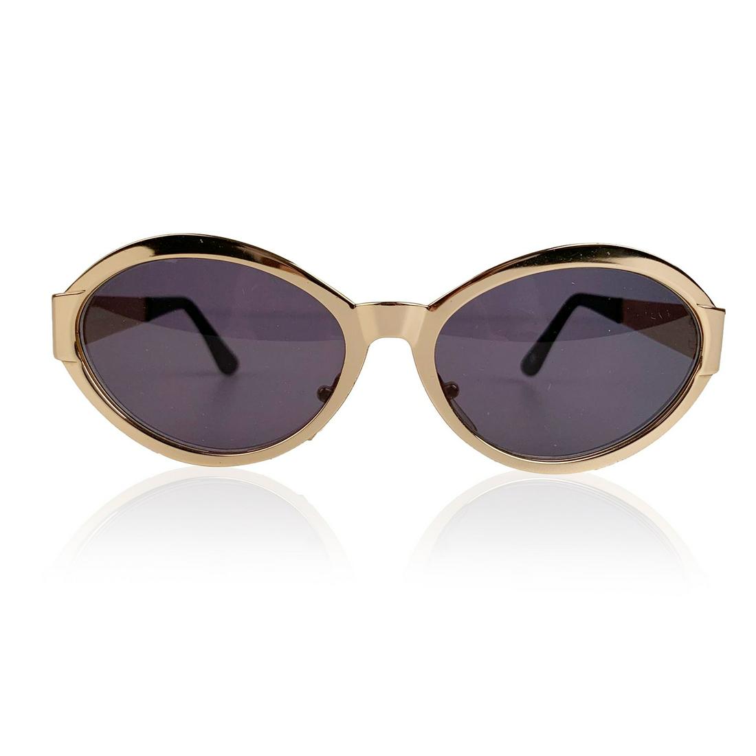 Gianni Versace Vintage Gold Metal Medusa Sunglasses Mod: Beautiful vintage Gianni Versace Mod S 97 Col. 030 sunglasses. Gold metal oval frame with gray original lenses. Gold metal Medusa heads on temples. Adjustable nose pads . Made in Italy Details MATERIA