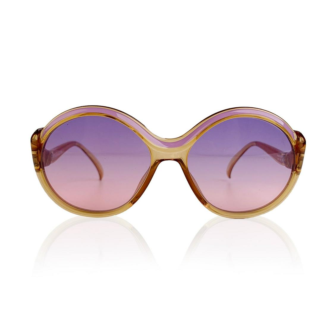 Christian Dior Vintage Pink Round Optyl Sunglasses Mod: CHRISTIAN DIOR Vintage 1970s pink and semi transparent honey color frame. Bicolor (purple and pink - gradient) new lenses. Optyl frame handmade in Germany. CD logo on temples. Mod. & Refs: 2078 - 80 -