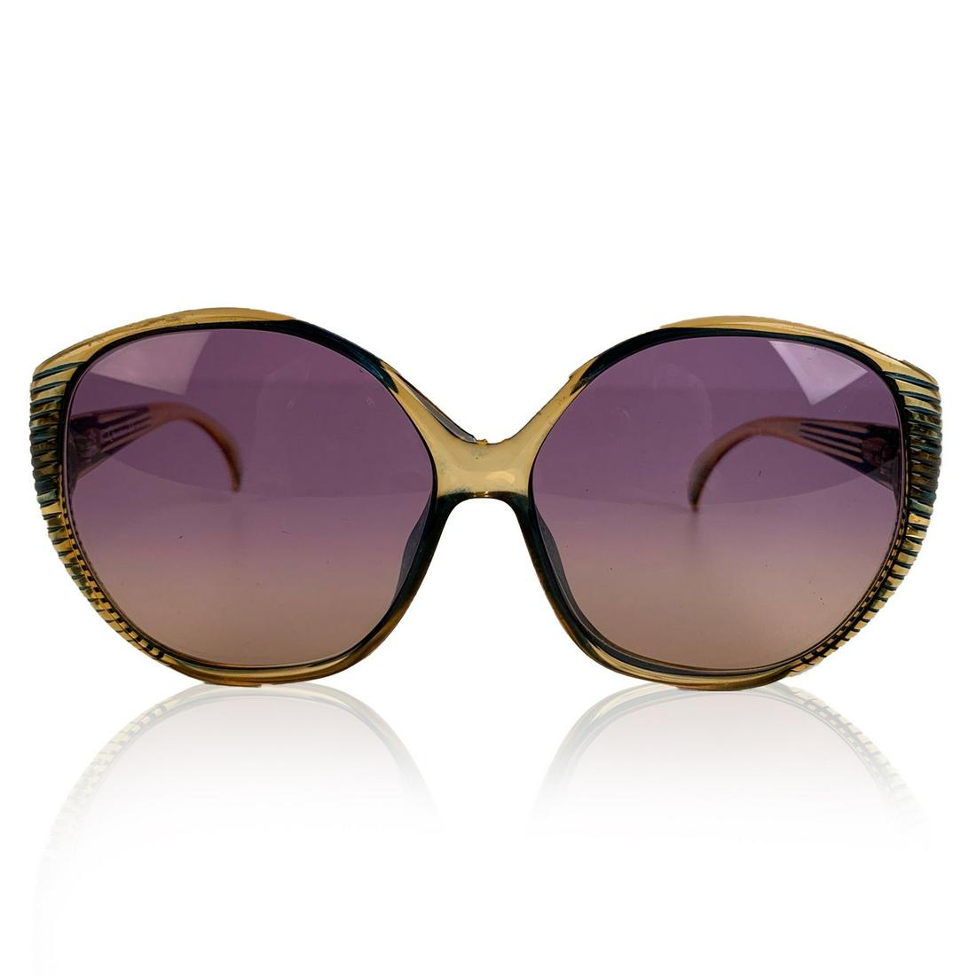 Christian Dior Vintage Oversized Green Optyl Sunglasses: CHRISTIAN DIOR Vintage 1970s Oversized green and semi transparent honey color frame. Bicolor (purple and yellow - gradient) new lenses. Optyl frame handmade in Germany. Details MATERIAL: Optyl COLOR: 