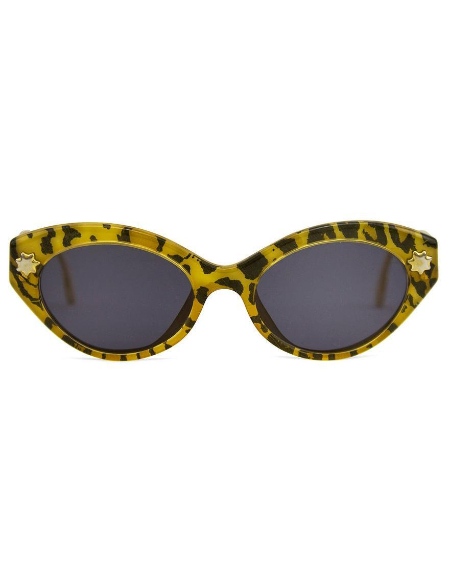 Christian Lacroix Leopard Print Sunglasses: 1980s Christian Lacroix cat eye shaped leopard print sunglasses. Small gold star and logo details. Cream interior with black brand stamp. Brand new black/grey lenses. Excellent vintage condition. No c