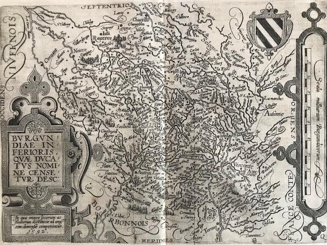 RARE map of Burgundy region of France: Title: RARE map of Burgundy region of France Description: Large decorative car touch and measuring mile scale decorate each side of the map, as well as a coat of arms. 3 tiny holes right on the center