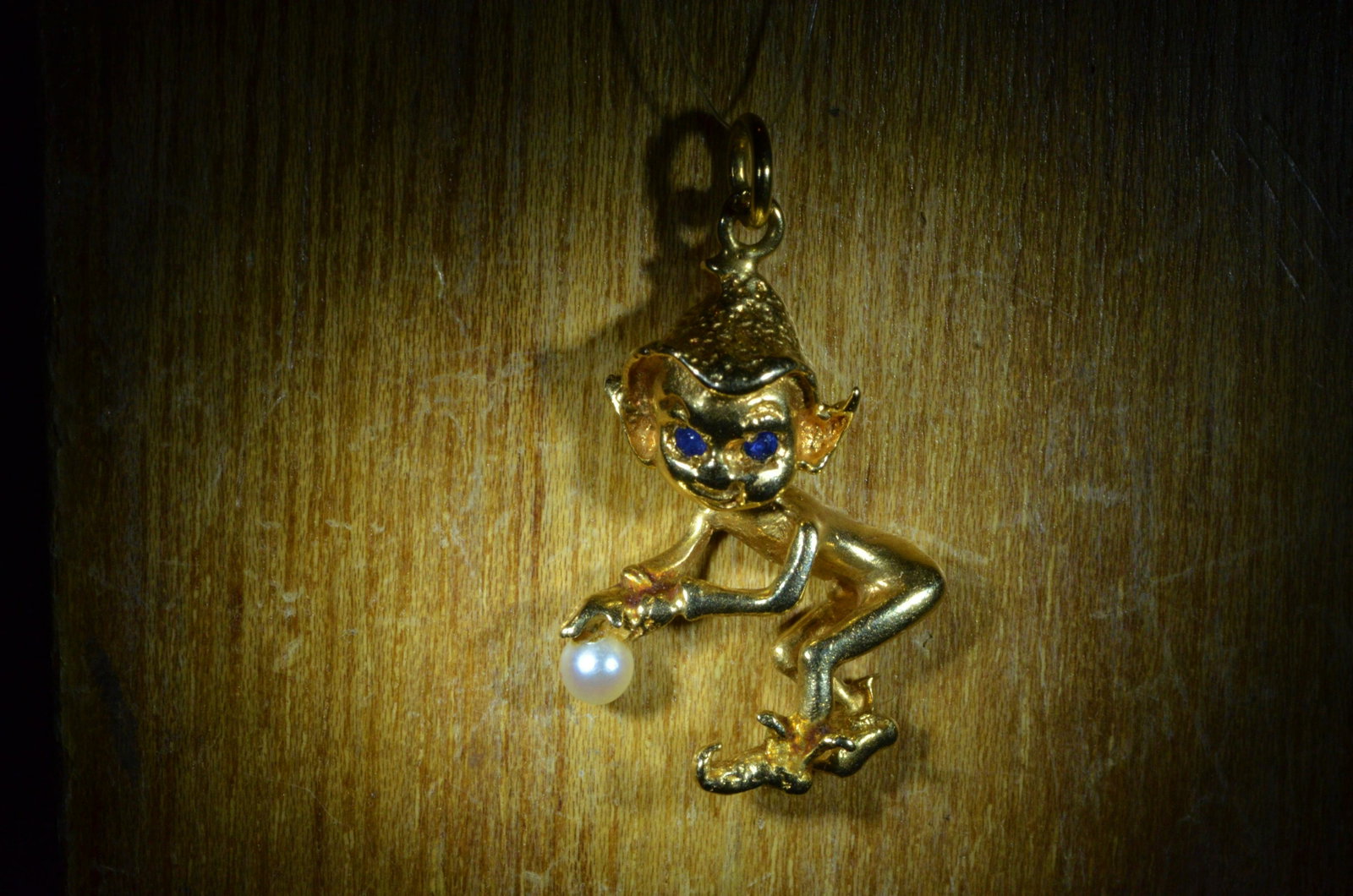 Vintage Yellow Gold Elf Pendant Set With Sapphires And: Title: Vintage Yellow Gold Elf Pendant Set With Sapphires And Pearl Metal Purity: 14 KT Yellow Gold Gemstones: Seed Pearl, Sapphire Gold Weight: 2.9 Size/Dimensions: 1.25" Additional Information: Vint