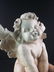 A large sculpture of a Cherub - 10
