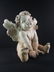 A large sculpture of a Cherub - 11