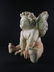 A large sculpture of a Cherub - 14