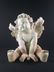 A large sculpture of a Cherub - 4