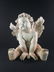 A large sculpture of a Cherub - 5