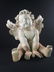 A large sculpture of a Cherub - 6