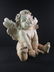 A large sculpture of a Cherub - 9