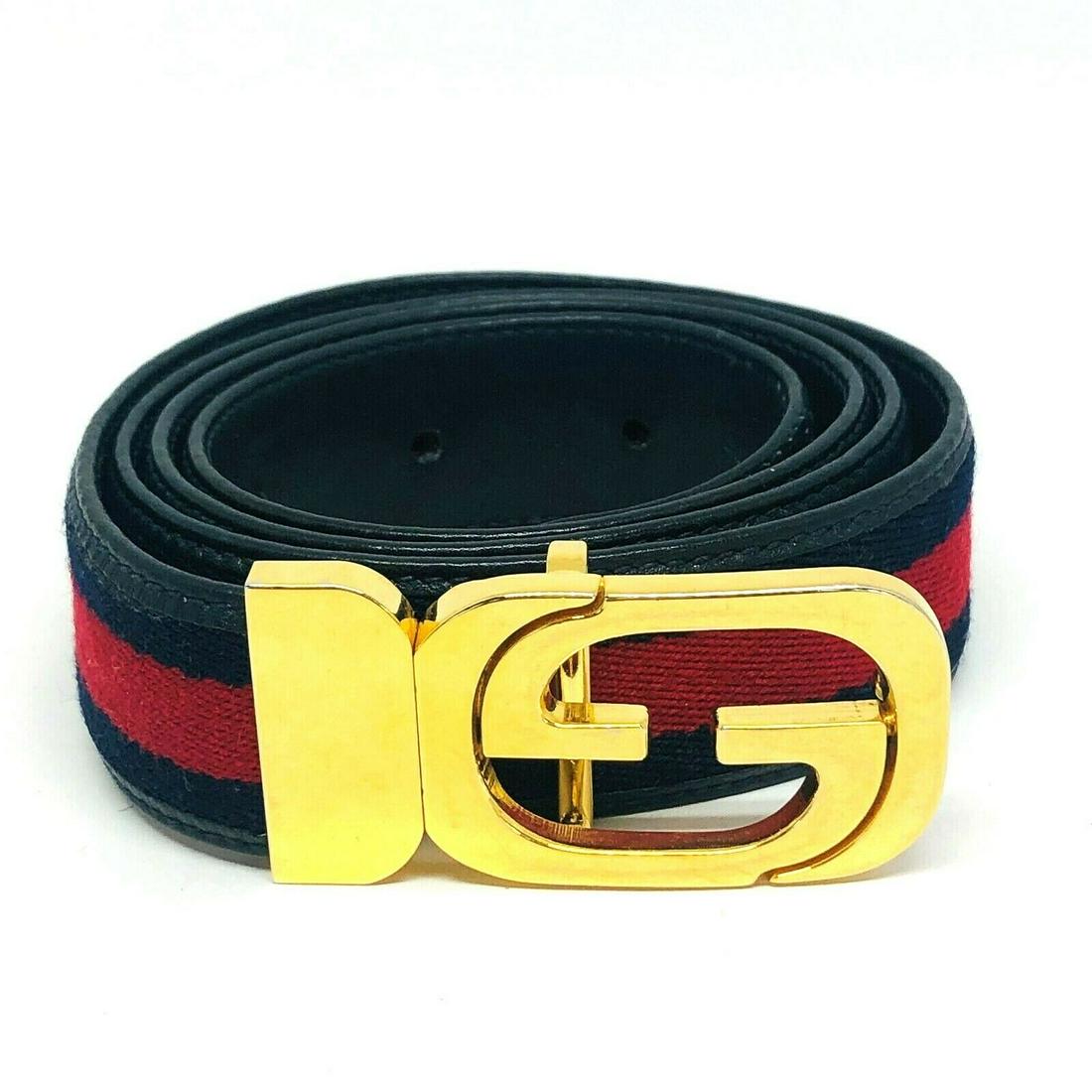 VINTAGE 1970: KG U00 VINTAGE 1970's GUCCI Signature Green Red Nylon Brown Leather Gold Buckle Belt Navy and red nylon Navy leather Antique brass-toned hardware The belt measures 1.25" width, 42.5Â” length The bu