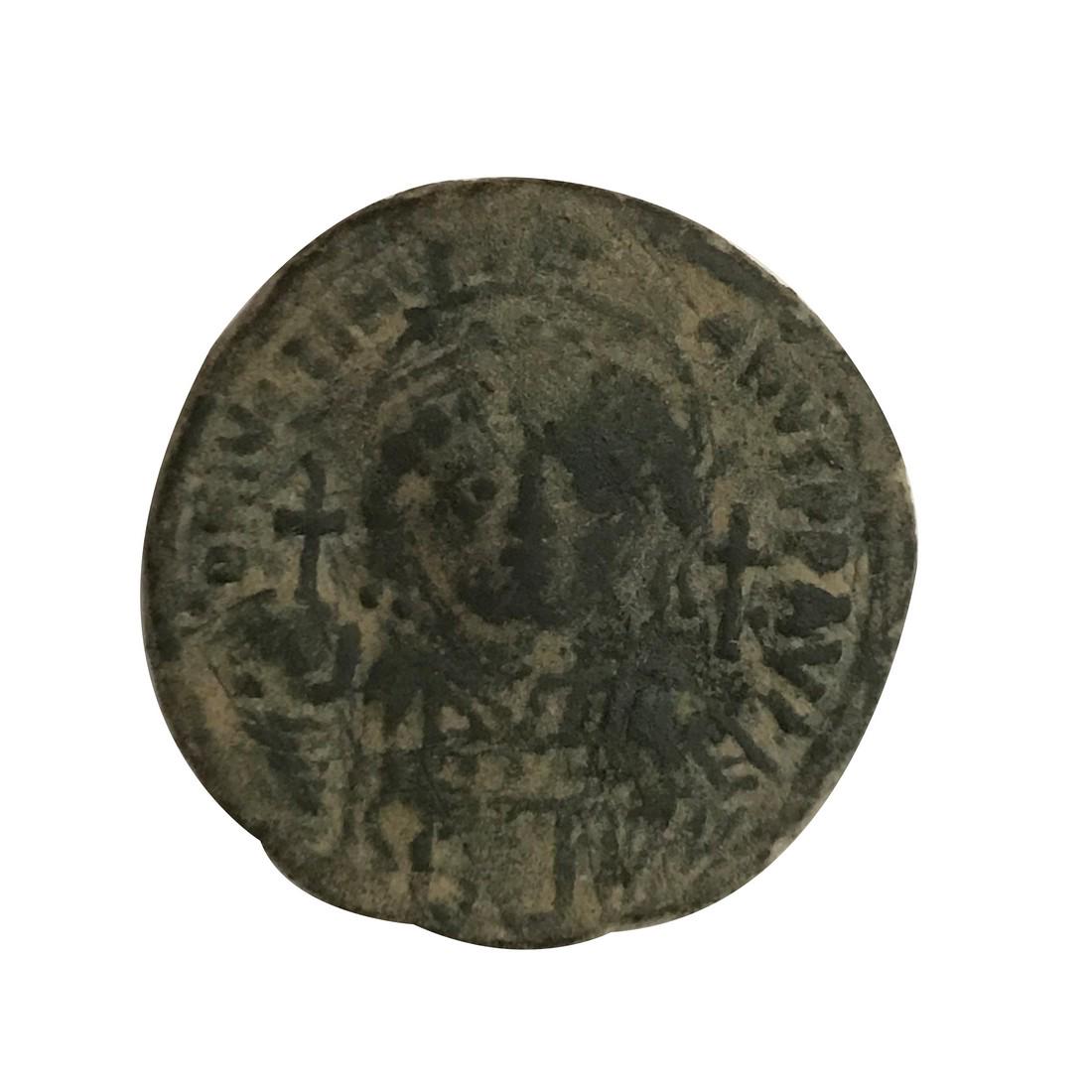 Byzantine Empire. Justinian l. 1/2 follis: Title: Byzantine Empire. Justinian l. 1/2 follis Date/Period: 527-565 C.E. Dimension: Material: Copper 1/2 follis. Or 20 nummi Description: Byzantine Empire. Justinian l. 527-565 C.E. Struck c540/541 