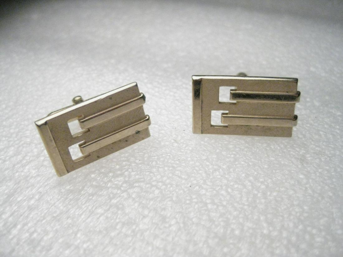 Vintage 1960's Swank Art Deco Cuff Link & Tie Bar/Clip,: Vintage 1960's Swank signed goldtone cuff links and tie bar/clip - cuff links are rectangular and about 1" wide and 2/3" tall with textured and shiny surfaces and cut-outs - art deco design. The tie b