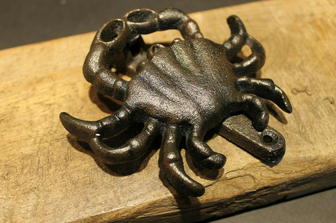 Cast Iron Crab Door Knocker: 5" Tall x 4 1/2" Wide x 1 1/4" ExtensionGreat reproduction crab door knocker cast from an antique. Really great authentic looking detail and slight antique patina. This piece is in powder coated cast 