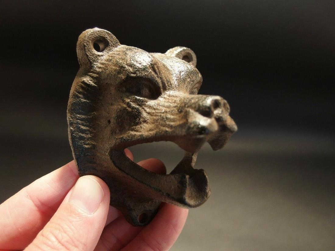 Cast Iron Wall Mount Figural Bear Beer Bottle Opener: 3 1/4" Tall x 3" Wide Great reproduction cast iron bottle opener. This piece was made to look just like an antique, but is new. Reserve: $10.00 Shipping: Domestic: Flat-rate of $6.00 to anywhere withi