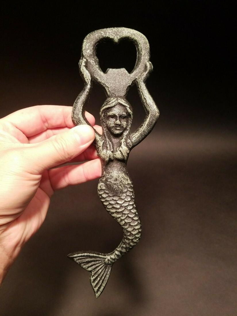 Cast Iron Mermaid Lady Soda Beer Bottle Cap Opener: 9 1/4" long x 3" wide Great reproduction heavy solid Iron bottle opener. This piece was made to look just like an antique, but is actually new. Nicely made all cast iron... Great for use or display! R