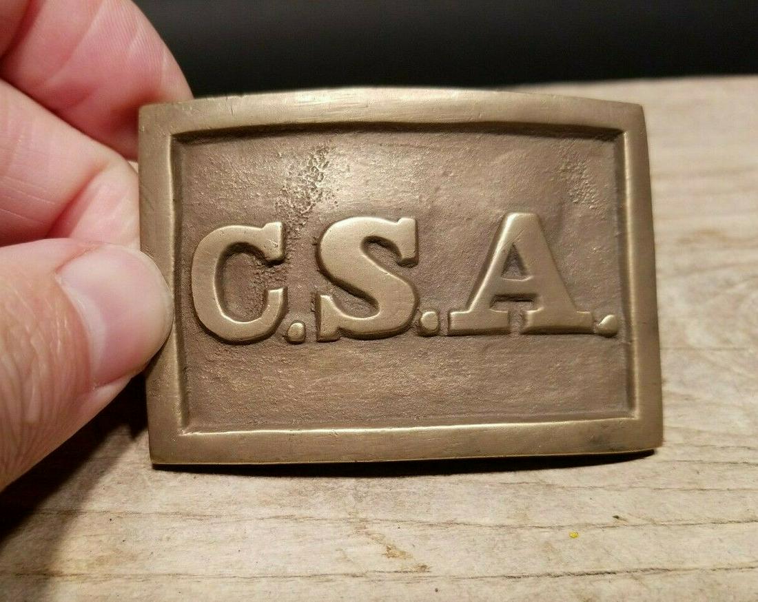 Civil War Confederate CSA Belt Buckle 3 Prong Brass: 2 1/2" long x 1 3/4" This all solid brass replica belt plate will surely make you wonder its age. It is made to look just like an antique The face of this plate has a very pleasing brown patina with s