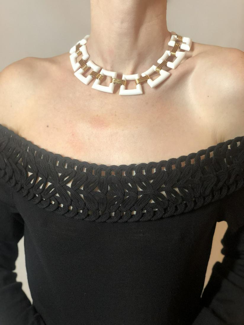 60s Trifari geometric white lucite necklace: TRIFARI 1960s WHITE GEOMETRIC NECKLACE WITH RIBBED "GOLD" LINKS CONNECTING IT. SUPER CHIC PIECE. (I HAVE TWO, SO I'M KEEPING ONE!) Brand: TRIFARI Materials: WHITE LUCITE/PLASTIC AND GOLD-TONED METAL B