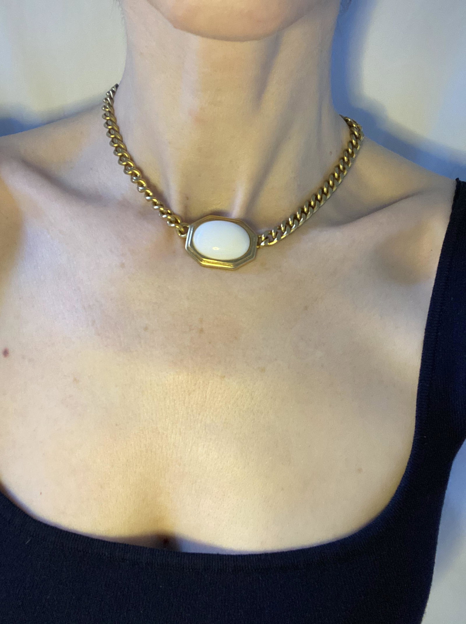 70/80s Trifari chain necklace with white centerpiece: TRIFARI VINTAGE TRIFARI CHAIN WITH FRAMED WHITE OBLONG CENTER "PIECE." HAS SAME FEEL AS BULGARI "COIN" NECKLACES THAT ARE SO POPULAR RIGHT NOW. I ADDED LOOPS TO MAKE THIS, NO SURPRISE, CHOKER-LENGTH. 