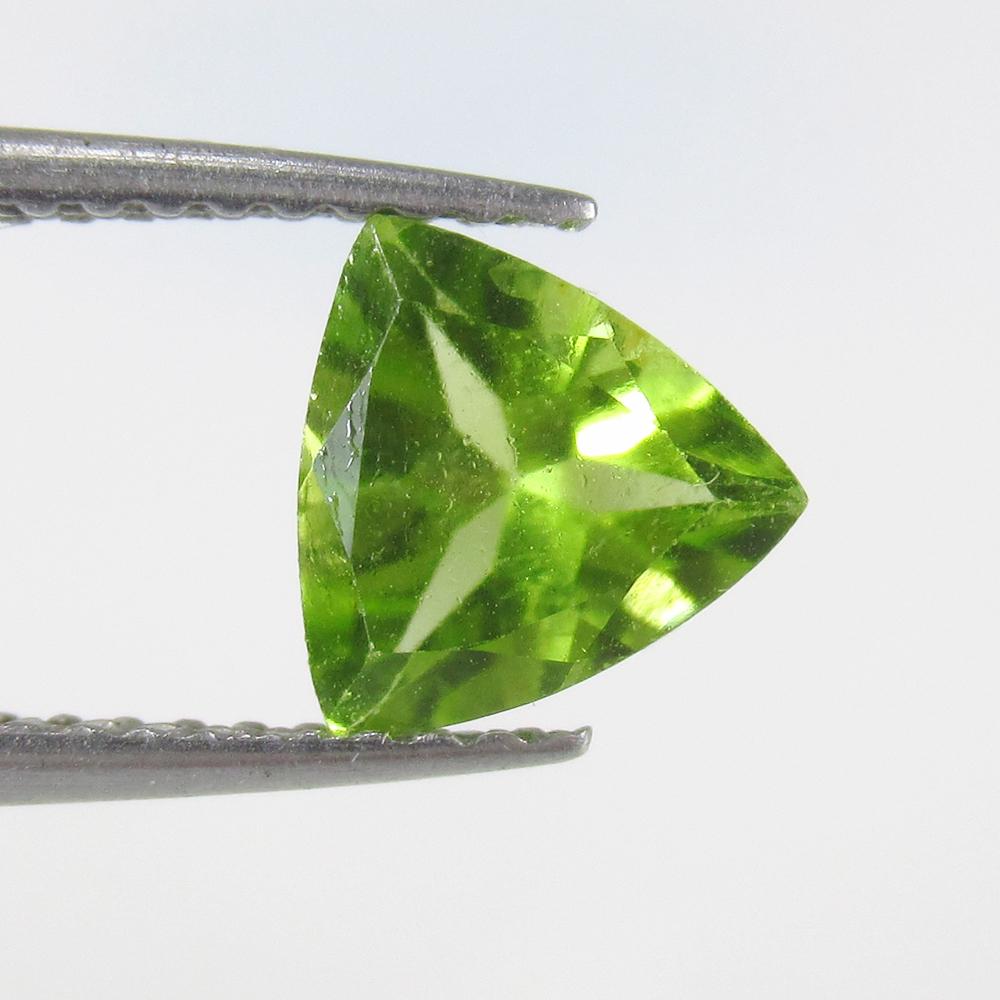 1.12 Ct Natural Pakistan Peridot Trillion Cut: No Reserve! Title: 1.12 Ct Natural Pakistan Peridot Trillion Cut Stone Clarity: VVS Gemstone: Natural Peridot Carat Weight: 1.12 Size/Dimensions: 7.00 x 7.00 x 4.00 mm Additional Information: Top Clas