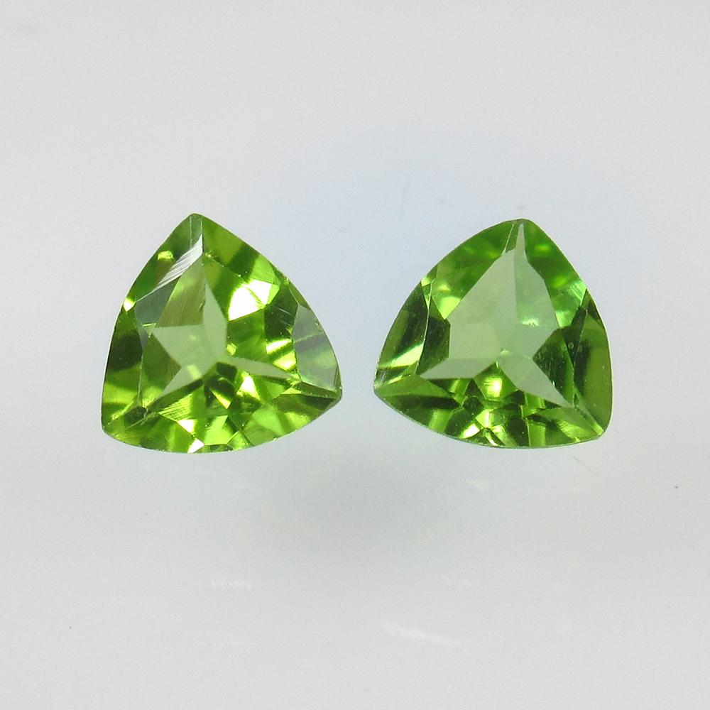 2.20 Ct Natural Pakistan Peridot Trillion Pair: No Reserve! Title: 2.20 Ct Natural Pakistan Peridot Trillion Pair Stone Clarity: VVS Gemstone: Natural Peridot Carat Weight: 2.20 Size/Dimensions: 7.00 x 7.00 x 3.40 mm / 2 PC's Additional Information