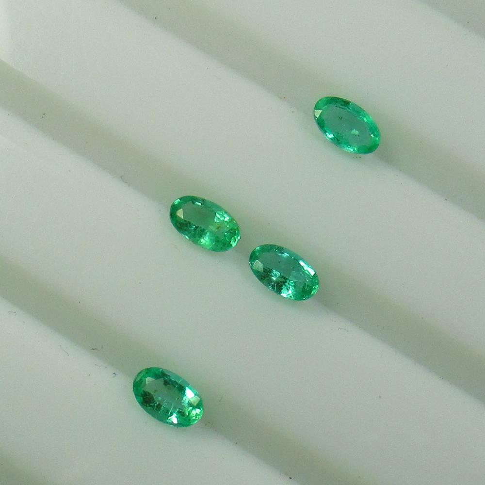 0.94 Ct Natural 4 Zambian Emerald Oval Set (1 of 2)