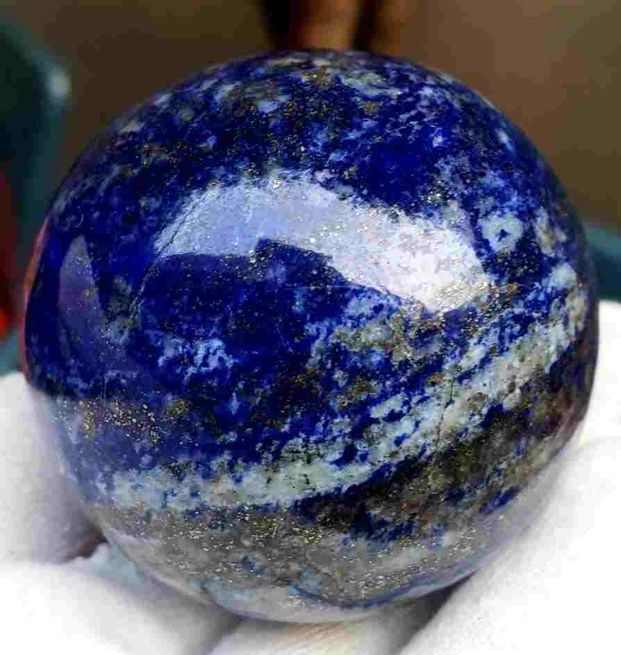 Polished Lapis Lazuli Sphere: Title: Polished Lapis Lazuli Sphere Stone Color/Clarity: Mineral Carat Weights: 296 GRAMS Size/Dimensions: Diameter - 58 mm Additional Info: Polished Lapis Lazuli Sphere Reserve: $90.00 Shipping: Dome