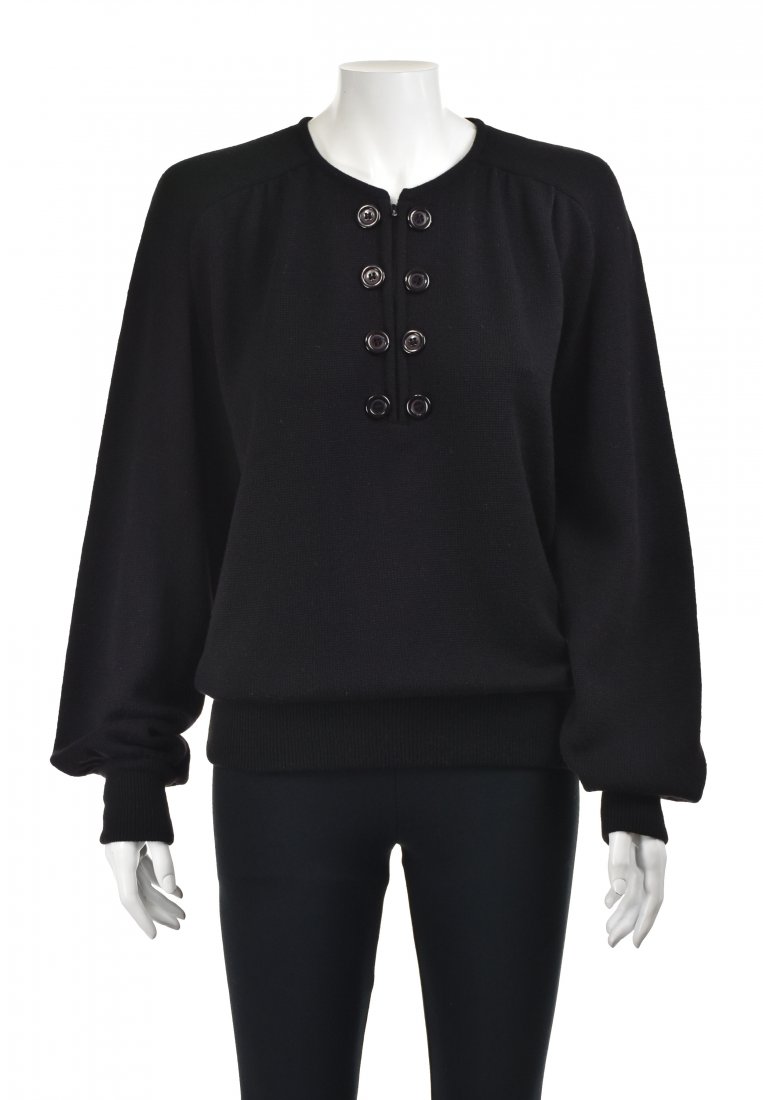 VALENTINO Vintage Black Cashmere Sweater: 1980s black cashmere sweater from Valentino features a half-zip front closure flanked by columns of large buttons, raglan shoulders and full, almost bishop style, sleeves. Cuffs and bottom are finishe