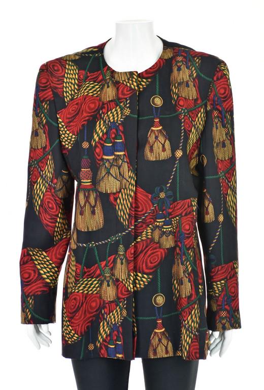 GLORIA SACHS Vintage Jacket with Tassel Print: 1980s vintage black wool blazer from Gloria Sachs has a very long silhouette and features a predominately red and gold pattern of tassels and fabric swags. A button placket hides the jacket's seven bu