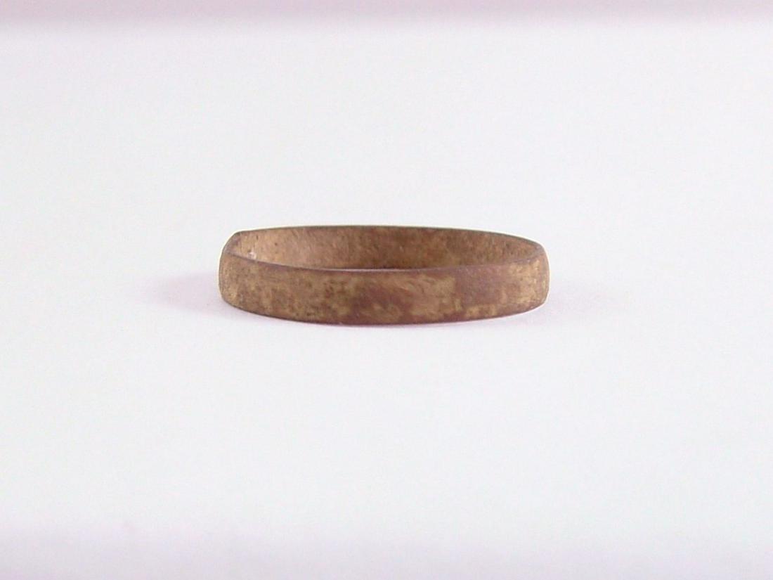 RARE VIKING WEDDING RING, 9TH-10TH CENTURY AD SIZE 3 ½: Cambridgeshire England. Size 3 ½ for the small finger as was the custom. 2.4mm width with low rounded face. Good patina and preservation with some surface verdigris from burial. Gift boxed with certi