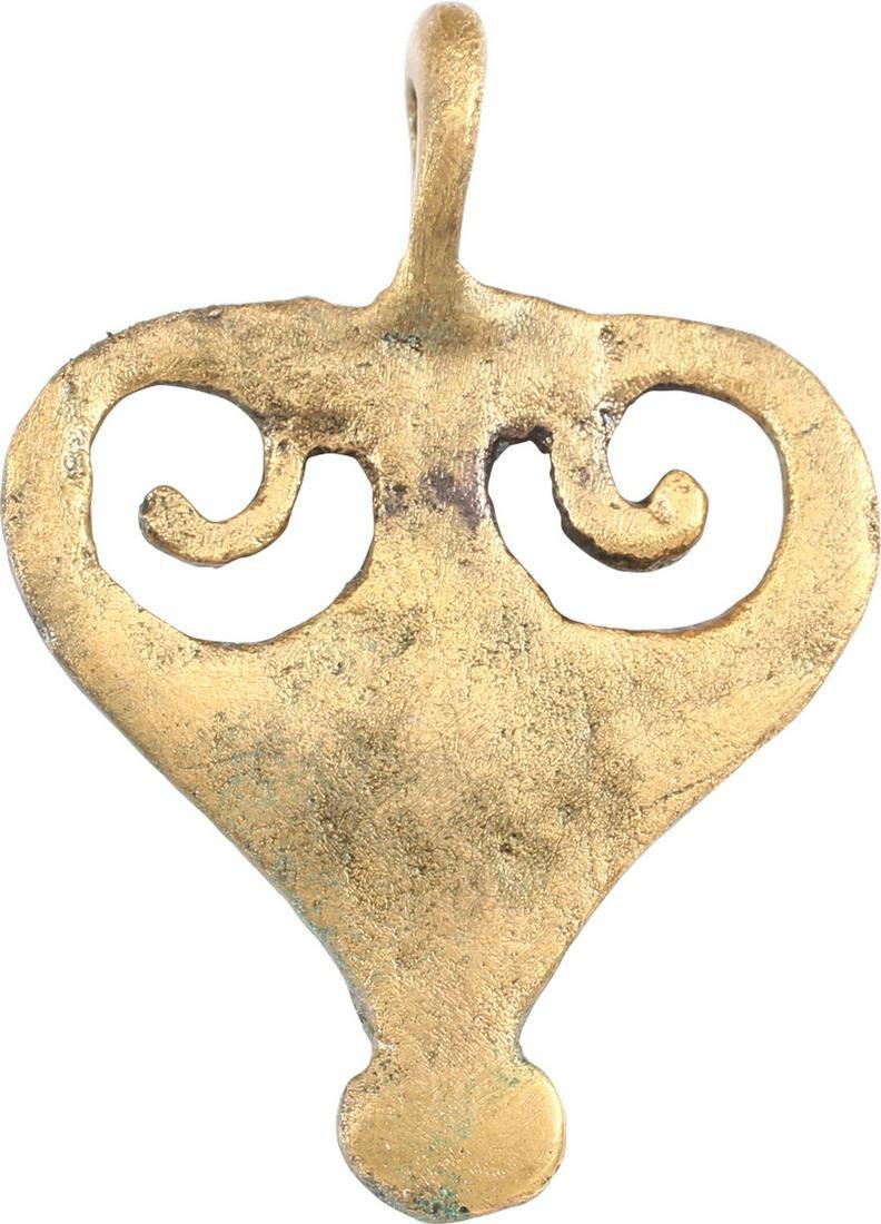 ROMAN LEGIONARY ARMOR MOUNT, 100-300 AD: Gilt bronze, about 1 3/8” height of spade form, delicately pierced with scrolls, with lobed terminal. Fastened to the laminar belt like leather protection for the area below the belt, the pteruges. 