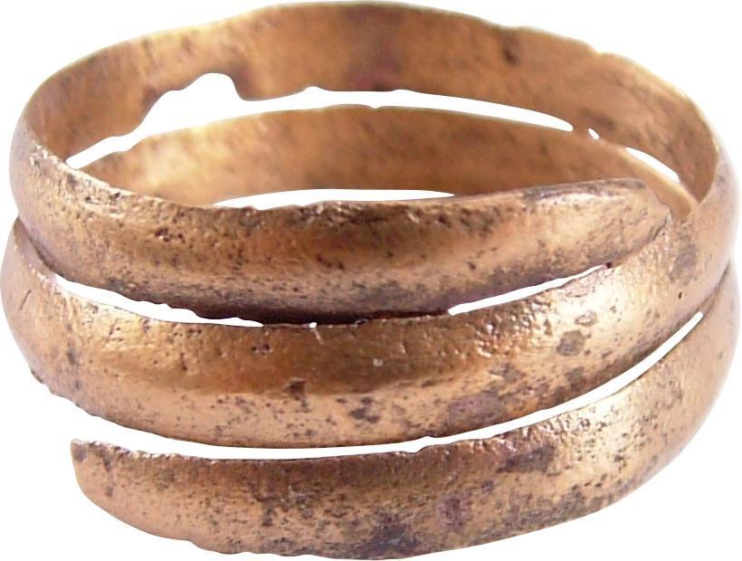 FINE VIKING COIL RING, 10th CENTURY AD JEWELRY: Size 10. Gilt bronze. Size 10. Rounded face band in 2 1/4 coils to1/4” width. Textured from burial. Sound wearable condition and professionally refurbished with the 24karat gold surface restored. Gi