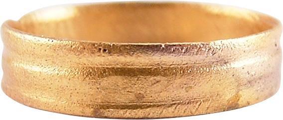 VIKING WEDDING RING, 9TH-11TH CENTURY JEWELRY, S 9.: Late 9th-early 11th century AD. Size 9. Near flat face, 4.0mm width, with two uniformly spaced depressed bands resulting in a five-tier form. The outer bands/edges with incised roped or hatch motif. L