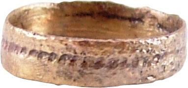 VIKING WOMAN’S WEDDING RING, 10th-11th CENTURY AD: Size 1 for the small finger as was the custom. Broad flat band 3.4mm width with stippled medial groove. Surface textured from burial. Professionally refurbished with the surface restored in 24 karat g