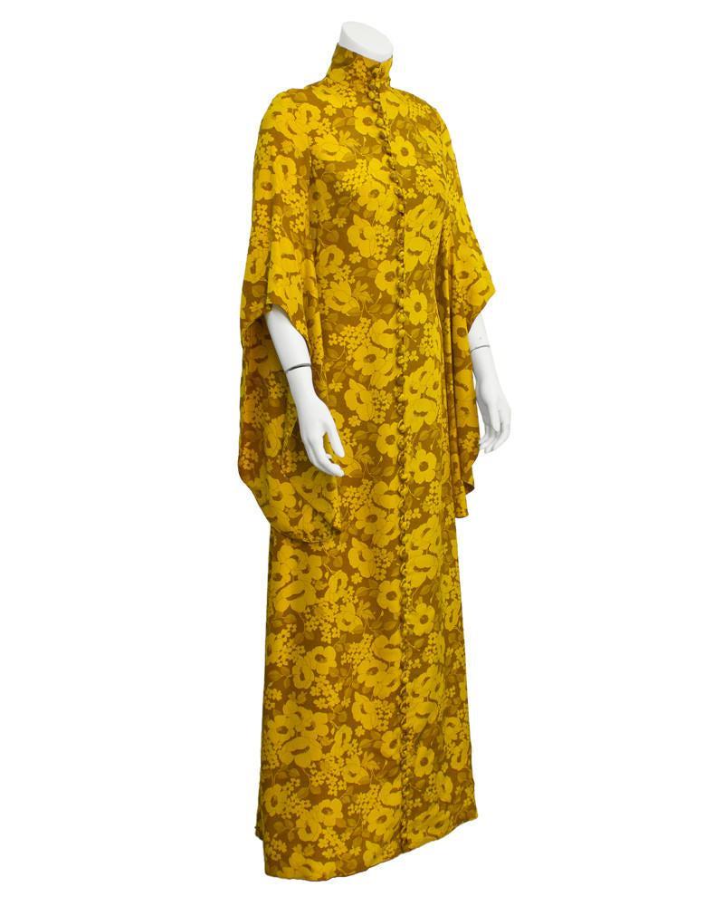 Annacat Yellow floral Maxi Dress w Half Angel Sleeves: A little slice of fashion history, and stunning to boot, this incredible dress from the late 1960s is by legendary London Boutique Annacat. Gold with tonal all over floral print and a lean silhouette 