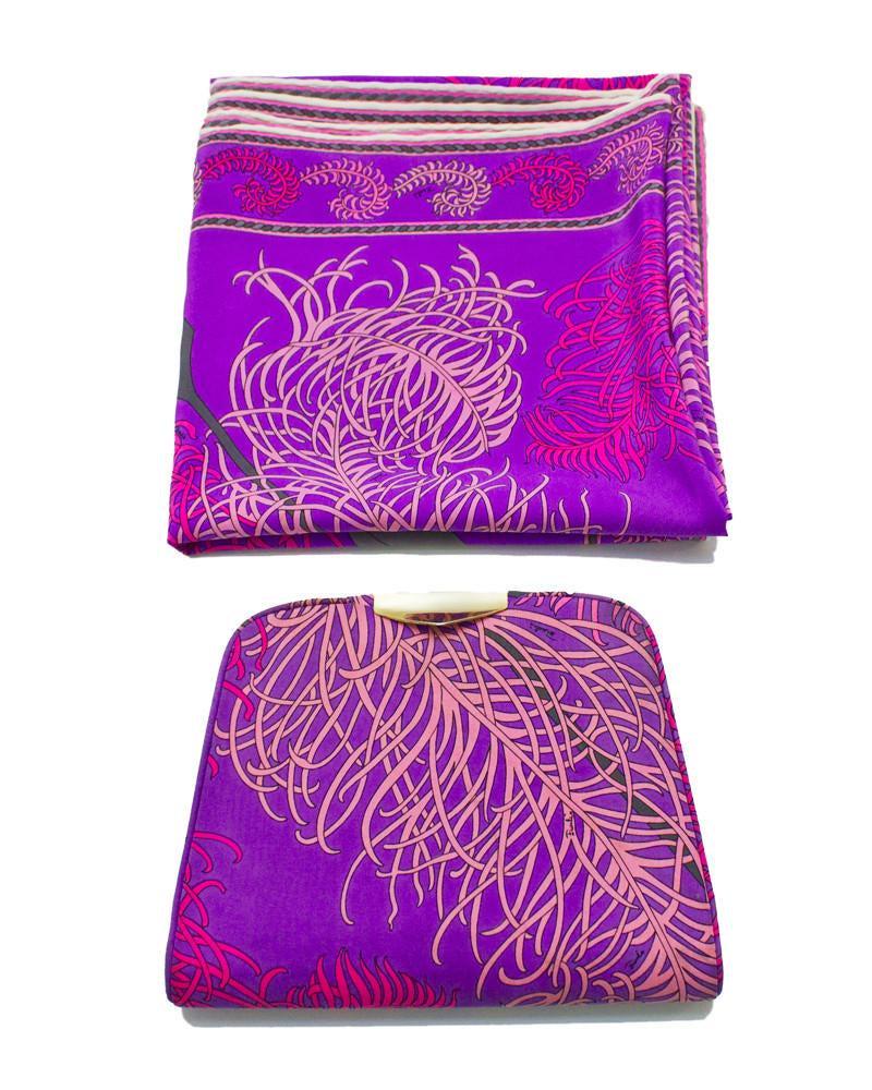 Emilio Pucci Purple & Pink Feather Printed Clutch &: 1960's matching clutch and silk scarf set. Both items use signed fabric with prints of pink feathers and grey arrows on a purple background. Clutch has gold tone metal detailing at clasp, simply pulls