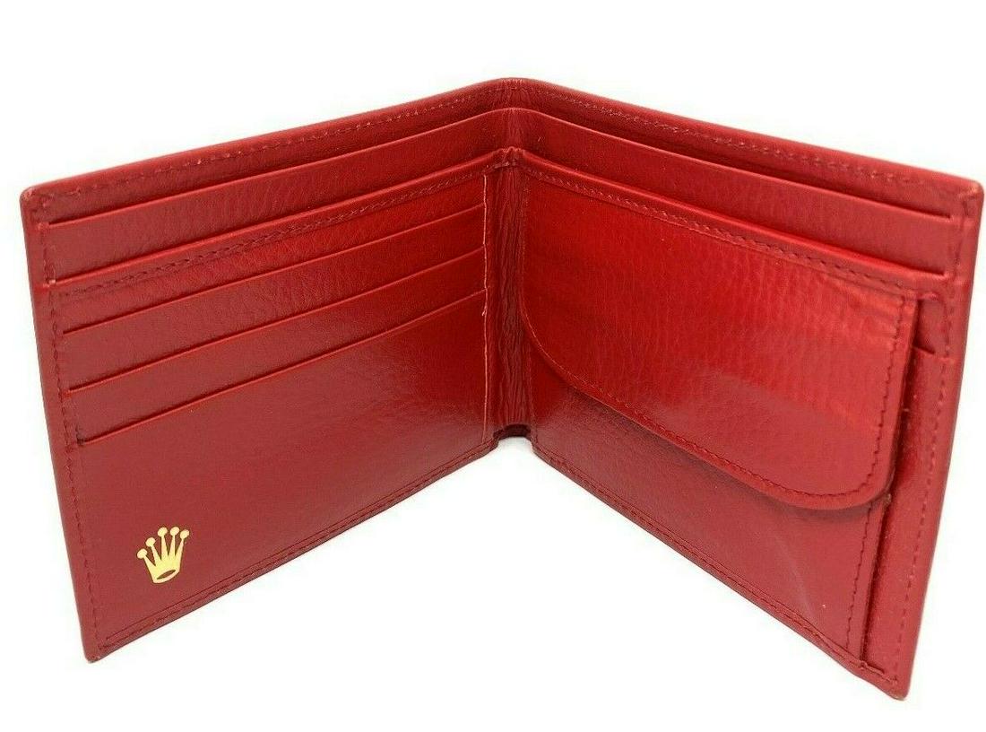 Vintage Montres Rolex Red Leather Wallet Card Holder: KG J00 Product details: Featuring red leather, 3 pockets for card on left side and coin purse attached on the right side with the gold button closure, 2 pockets for money. The wallet is stamped with M