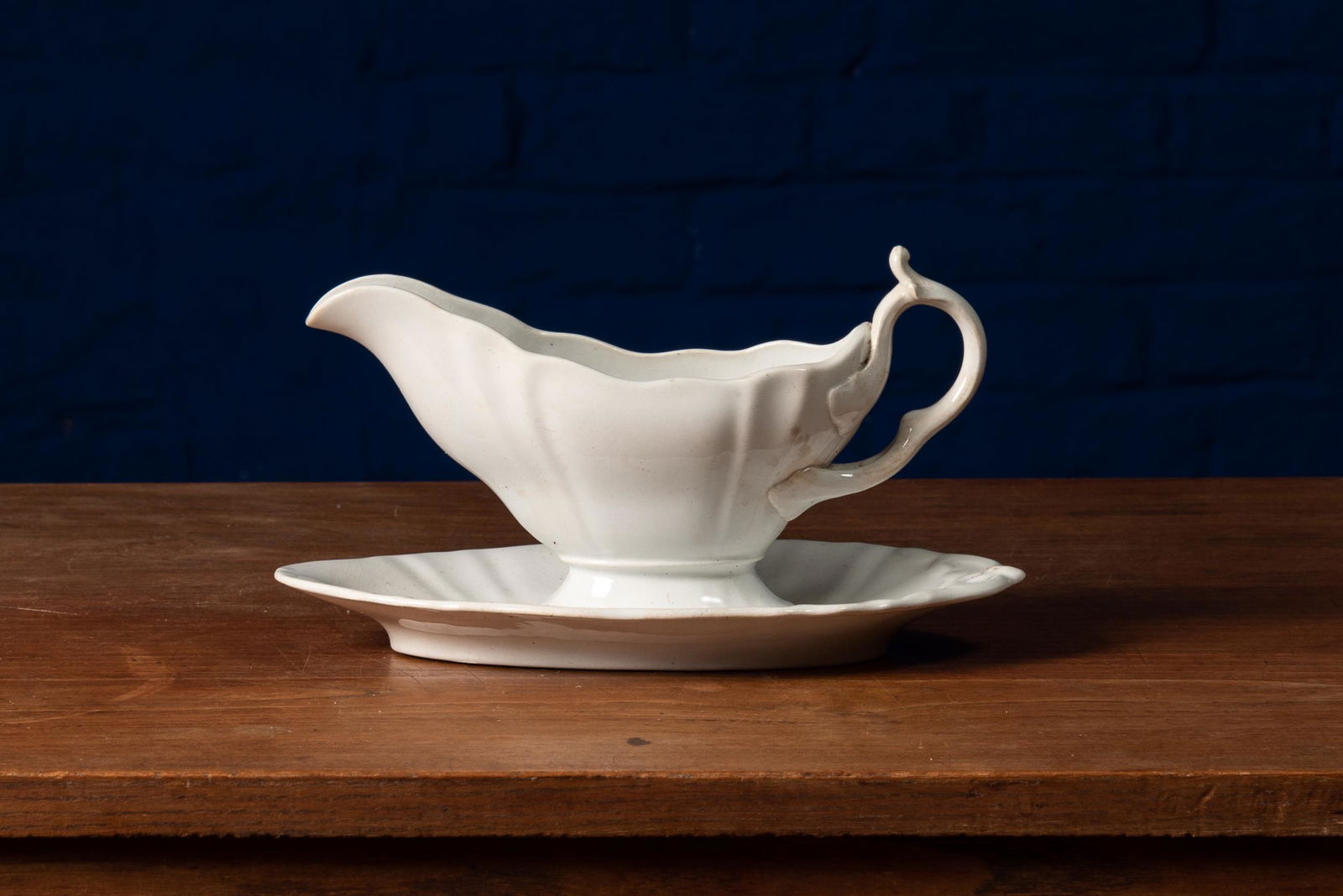 Elegant Saucer with white, elegantly curved handle. By: Title: Elegant Saucer with white, elegantly curved handle. By P. Regout & Co. Maastricht Description: Elegant Saucer with white, elegantly curved handle. By P. Regout & Co. Maastricht Material: Cerami