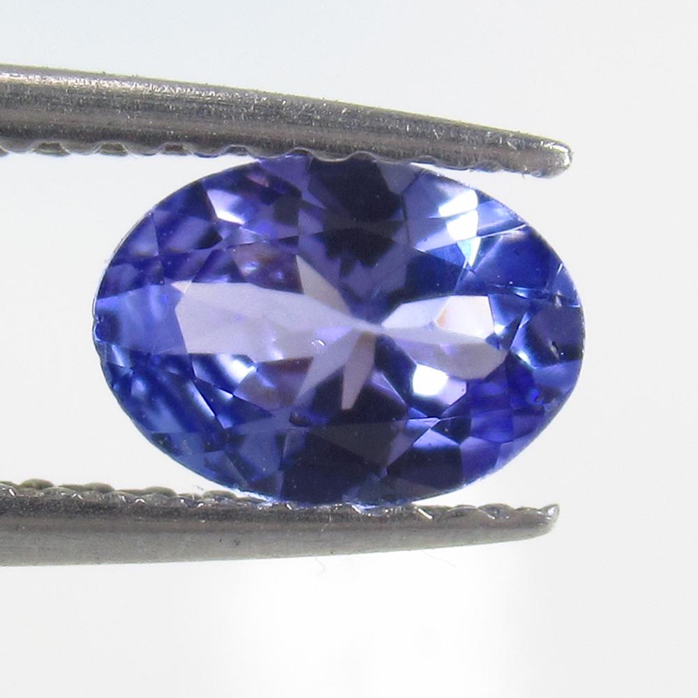 0.60 Ct Natural Tanzanite Oval Cut: Reserve: Title: 0.60 Ct Natural Tanzanite Oval Cut Stone Clarity: VVS Gemstone: Natural Tanzanite Carat Weight: 0.60 Size/Dimensions: 6.80 x 4.90 x 2.80 mm Additional Information: Top Quality Luster /