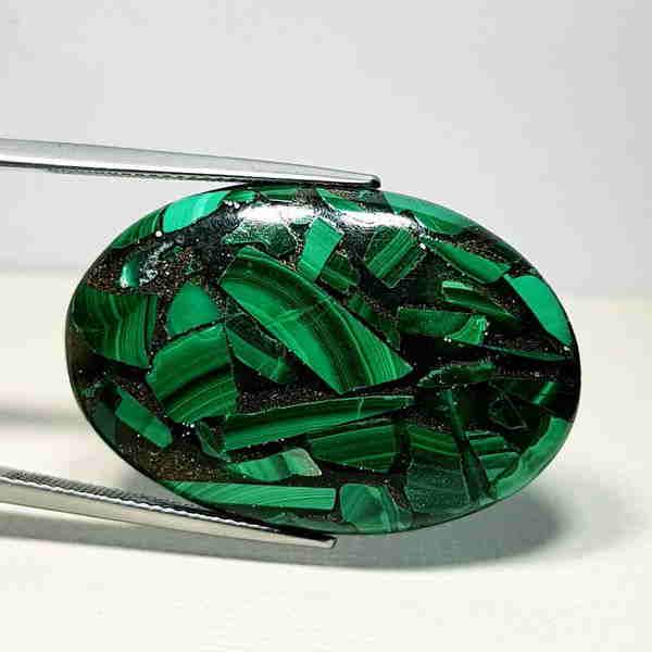 33.87 ct Natural Copper Malachite: Reserve: Title: 33.87 ct Natural Copper Malachite Color/Clarity: Opaque Type: Gemstones Carat Weight: 33.87 Size/Dimensions: 33.80 x 22.69 x 5.57 Additional Information: Oval - Africa Shippi