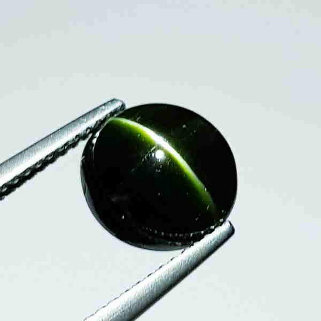 Natural kornerupine Cat's Eye 4.76 ct: Reserve: Title: Natural kornerupine Cat's Eye 4.76 ct Color/Clarity: Opaque Type: Loosegemstone Carat Weight: 4.76 Size/Dimensions: 9.50 x 9.50 x 6.50 Additional Information: Oval - Srilanka