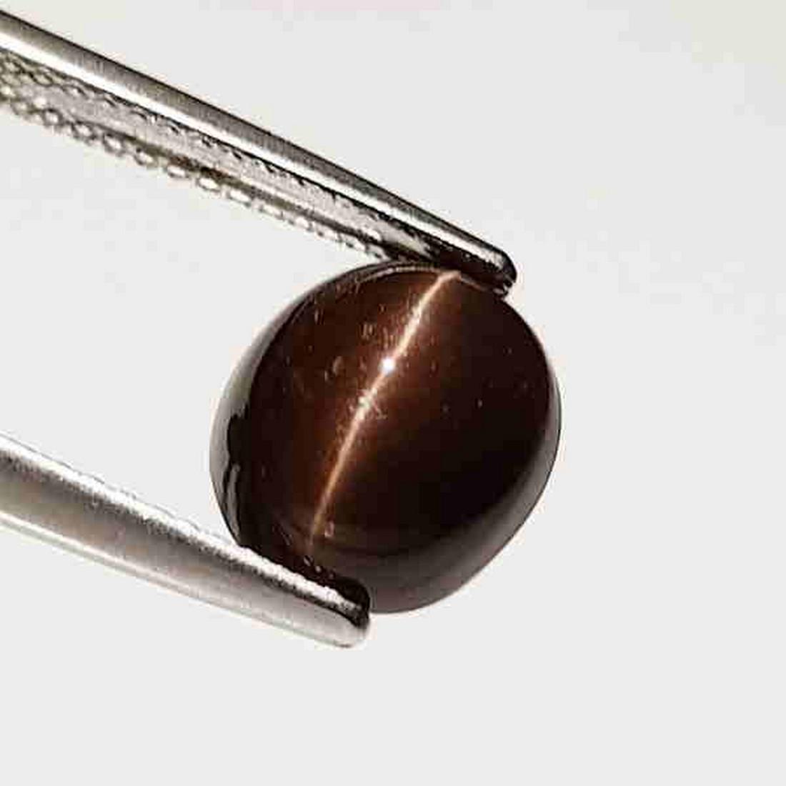 Natural kornerupine Cat's Eye 4.00 ct: Reserve: Title: Natural kornerupine Cat's Eye 4.00 ct Color/Clarity: Opaque Type: Loosegemstone Carat Weight: 4 Size/Dimensions: 9.70 x 8.50 x 6.50 Additional Information: Oval - Srilanka Sh