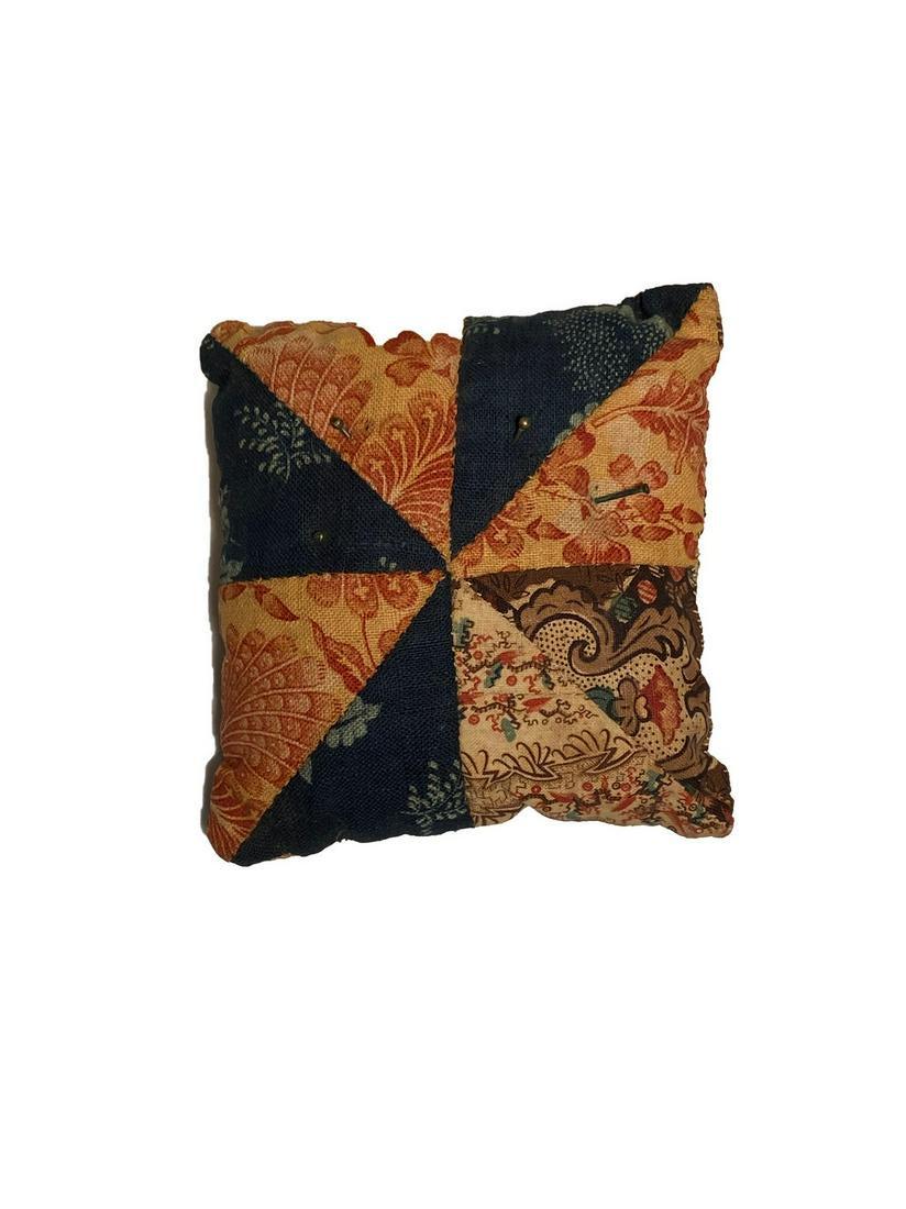 Pin Cushion Pillow: Title: Pin Cushion Pillow Dimension: 3 ½” x 3 ½ Provenance/Additional Info: A pin cushion pillow patchwork. With rose head pins. C. 1820 Shipping: Domestic: Flat-rate of $10.00 to anywhere within 