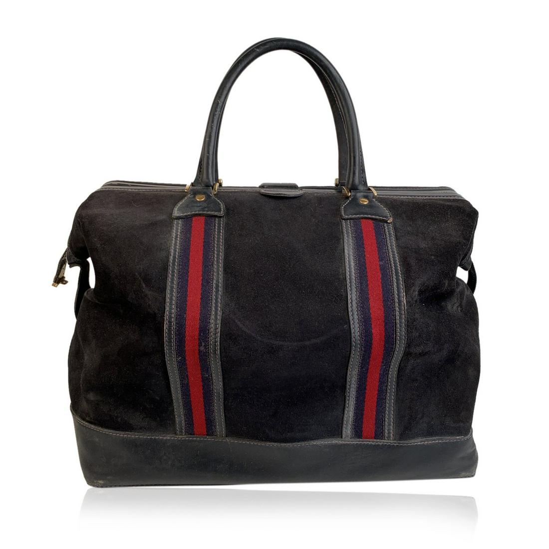 Gucci Vintage Blue Suede Web Travel Weekender Travel: Blue suede travel bag by GUCCI with Web red and blue stripes from the end of 1970s.. Upper main zipper closure. 5 Bottom gold metal feet. Side Lock (key is MISSING). Blue Gucci diamond internal lining