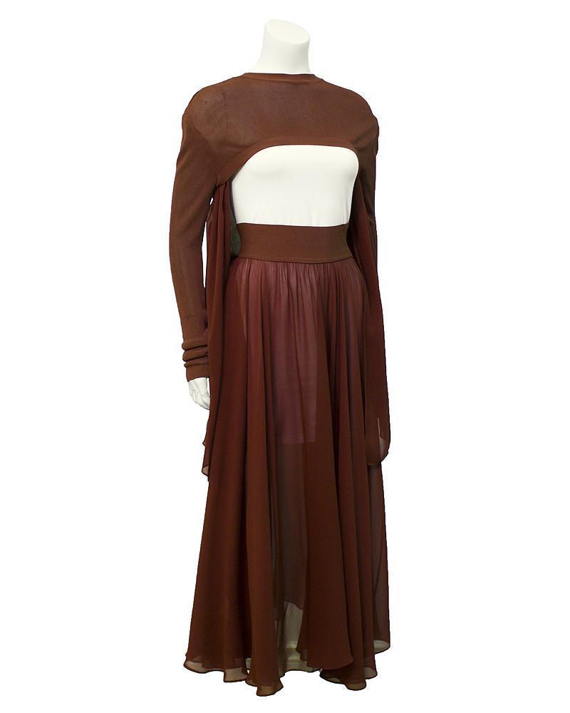 Jean Paul Gaultier Brown avant garde ensemble: Two piece avant grade Jean Paul Gaultier set from the 1990's. The matching set features a long sleeve high low top. The front of the silk and viscose top sits across the chest, while the back sits on 