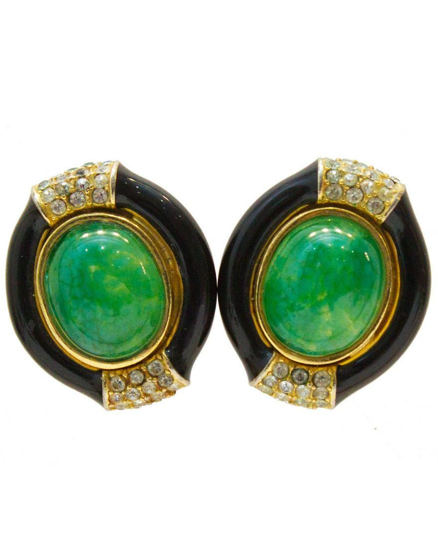 Anonymous Ciner Black Enamel and Green Clip-on Earrings: Ciner 1960's poured glass, enamel and rhinestone oval shaped earrings. The clip-on style earrings features a jade-like poured glass cabochon, set in a gold tone hardware, surrounded by a smooth black