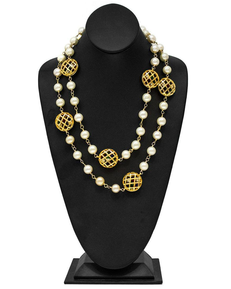 Chanel Pearl Necklace with Poured Glass Beads: Excellent 1980's Chanel necklace featuring pearls and hollow basket weave gold cages filled with green, blue and red poured glass beads. Can be worn long or wrapped around neck. Chanel markings on ins
