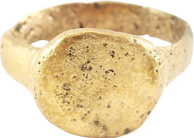 FINE VIKING WARRIOR’S RING, 10th-11th CENTURY AD: Broadband, 3.6mm, with a rounded face, flaring slightly to the shoulders. Large rounded edge squared circle bezel. Surface textured from burial. Professionally refurbished with the 24karat gold overla